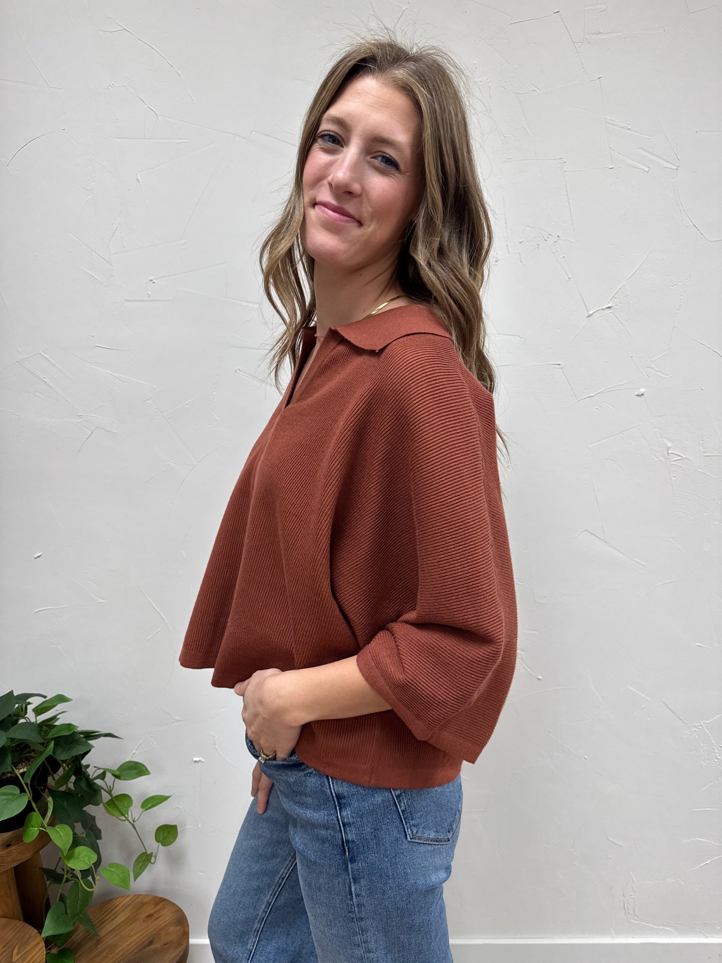 Solid 3/4 sleeve knit top with open V-neck collar