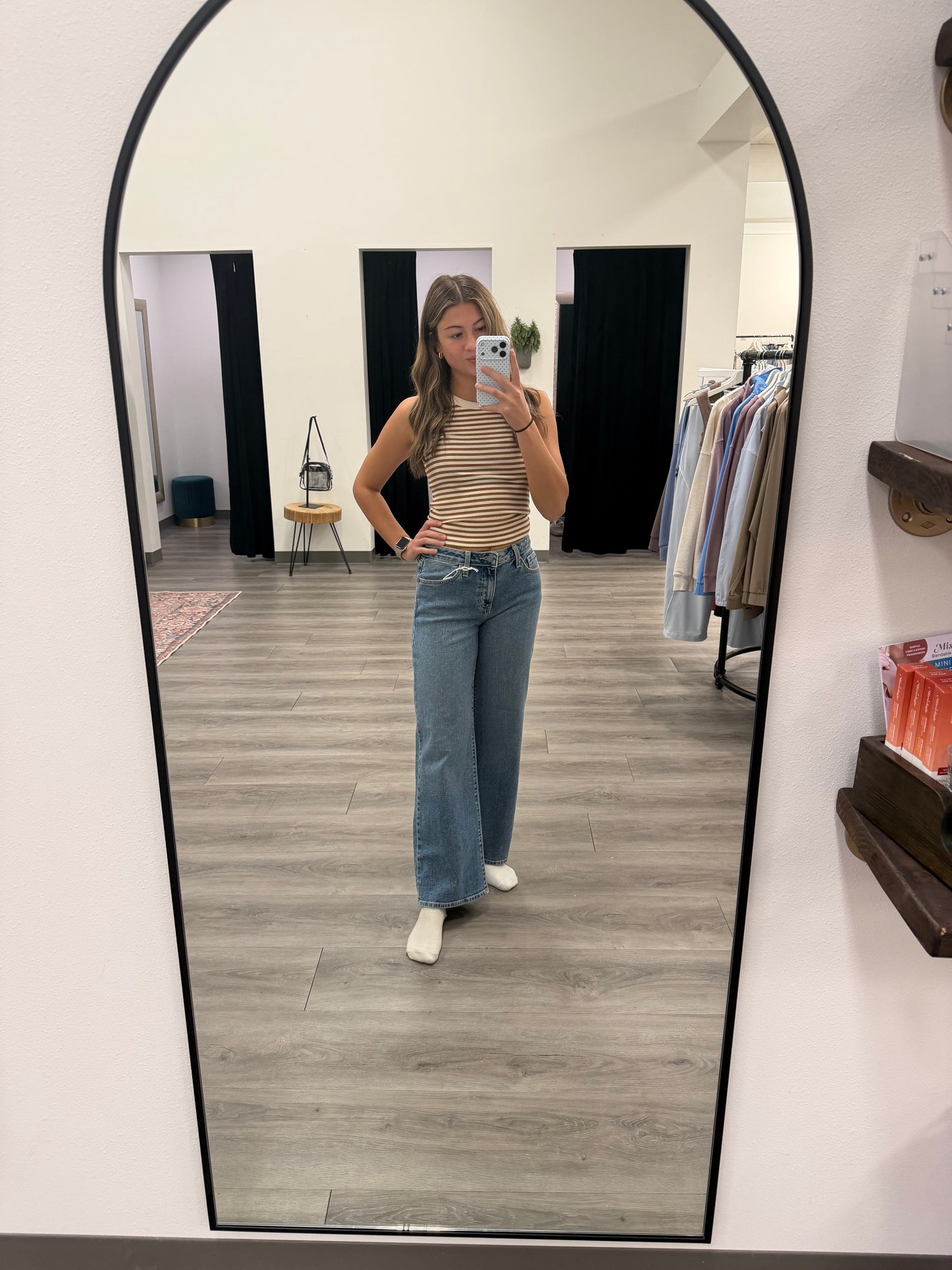 Lifestyle shot of model wearing wide leg denim styled with casual top — Three:Twelve Boutique