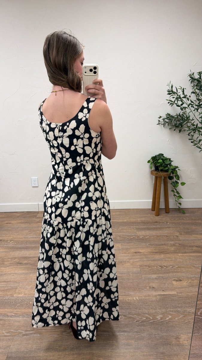 Back view of model wearing floral maxi dress showing drop waist design — Three:Twelve Boutique
