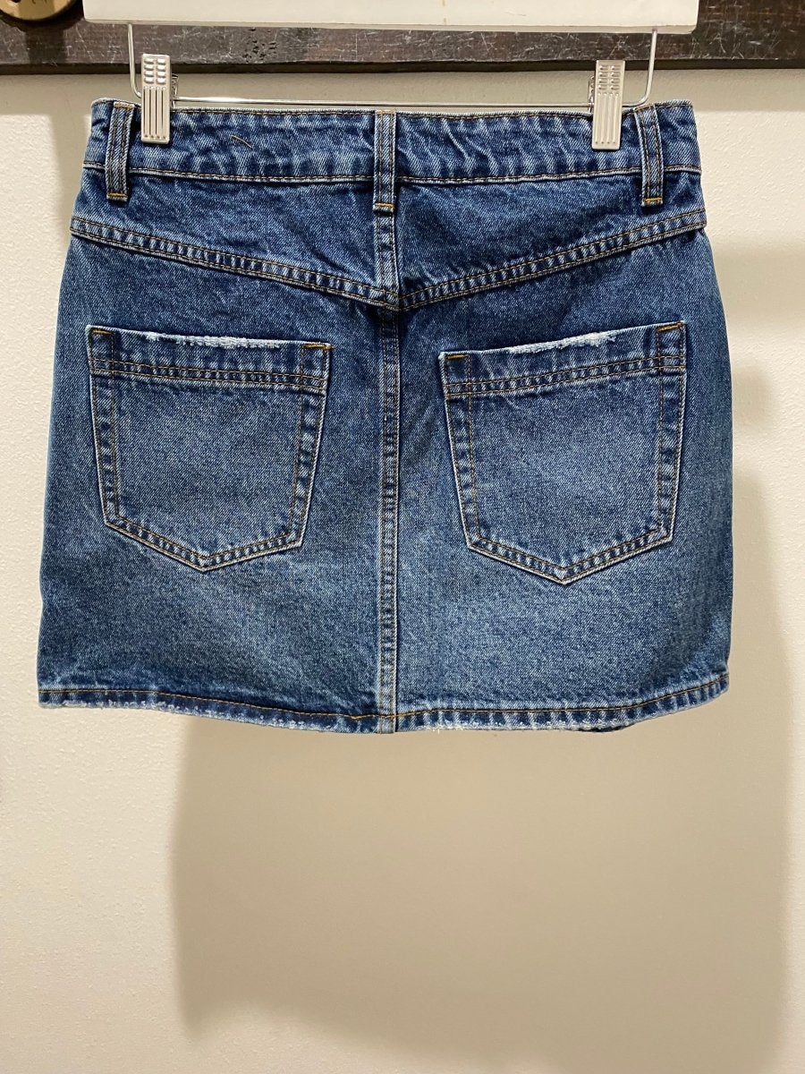 Back view of denim mini skirt highlighting clean seam detailing and fit — Three:Twelve Boutique