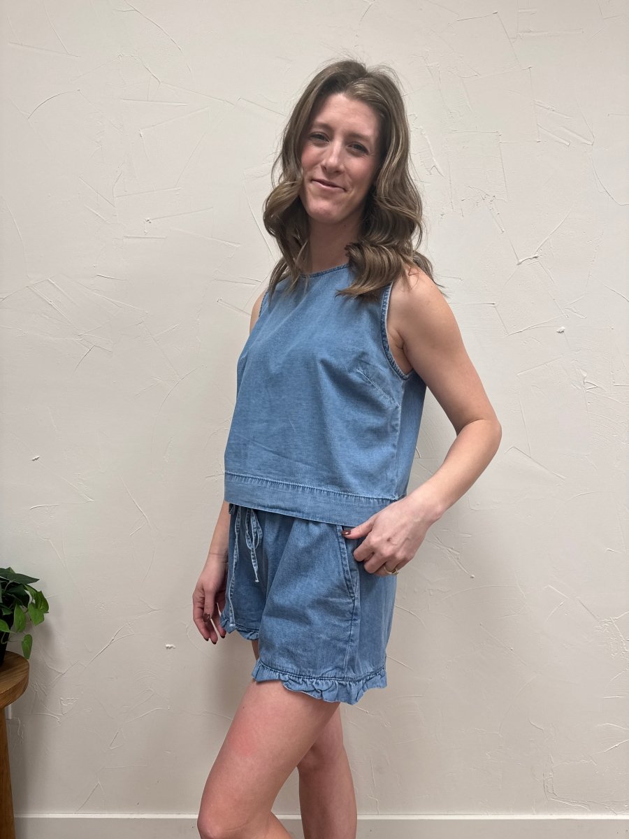 Side view of denim ruffle hem shorts showing silhouette and length — Three:Twelve Boutique