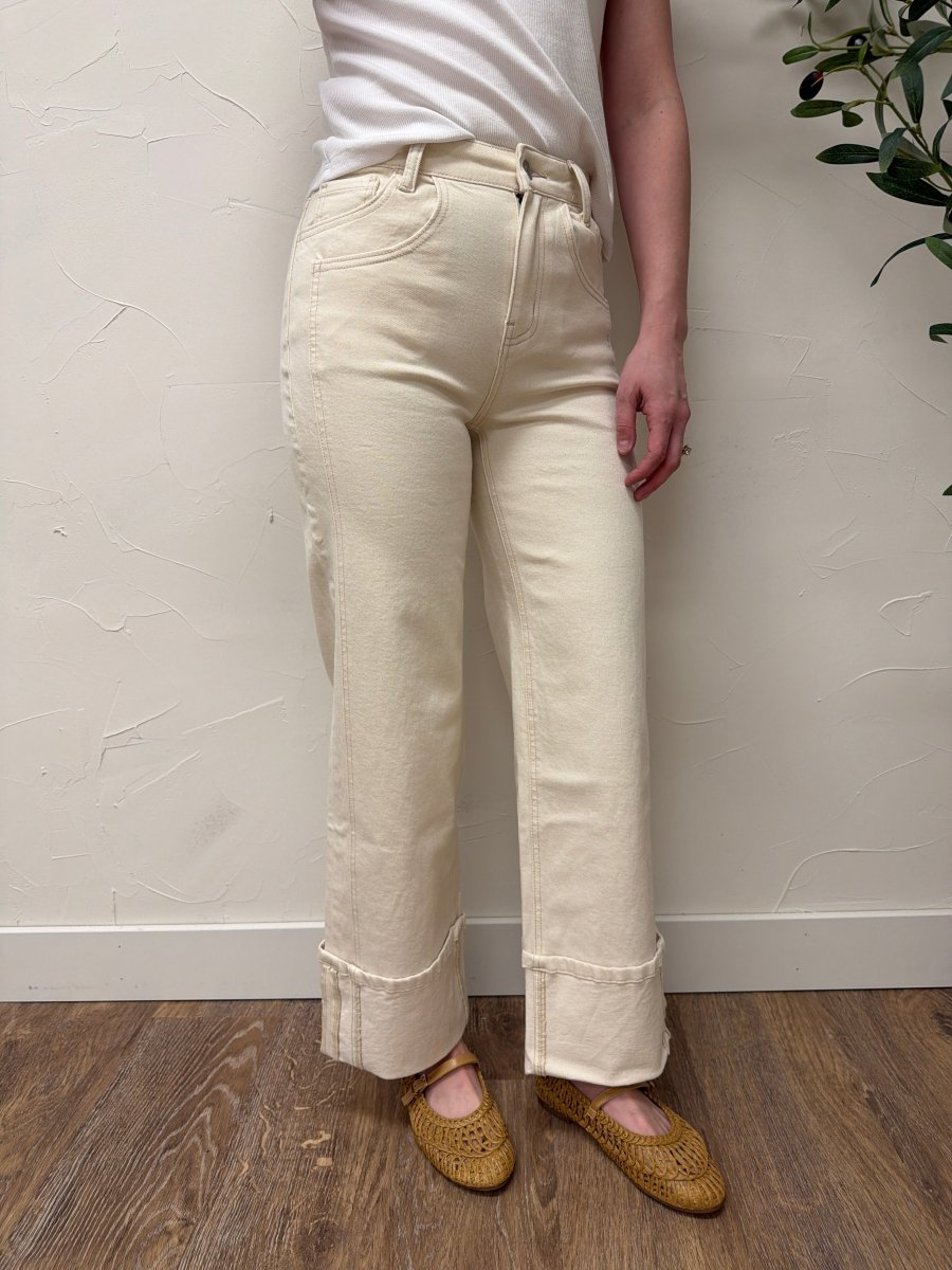 Lifestyle shot of model wearing High Rise Cuffed Wide Leg Vervet Denim jeans paired with casual top — Three:Twelve Boutique