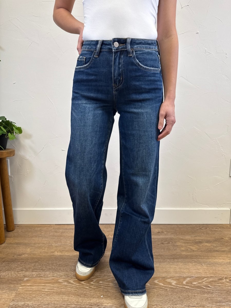 Front view of high rise dark wash wide leg jeans on model showing full length fit — Three:Twelve Boutique
