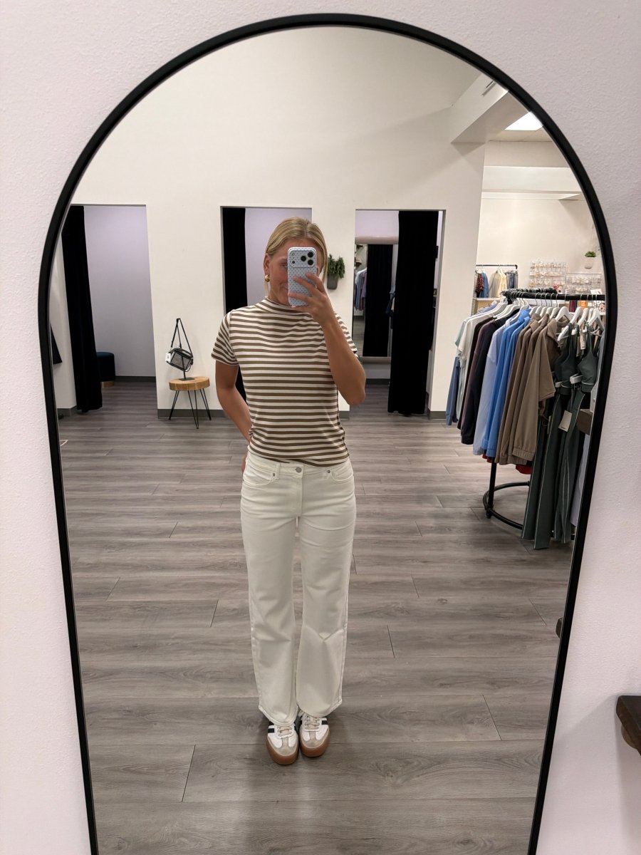 Lifestyle shot of model styling high rise straight jeans with a casual top — Three:Twelve Boutique