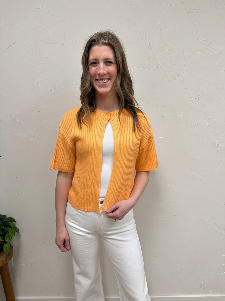 Lifestyle shot of model wearing sweater cardigan styled casually — Three:Twelve Boutique