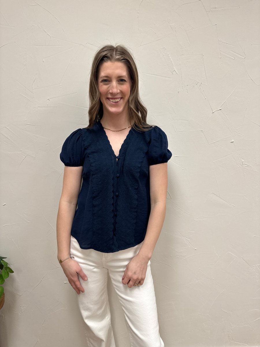 Lifestyle shot of model wearing lace button down top styled with casual outfit — Three:Twelve Boutique