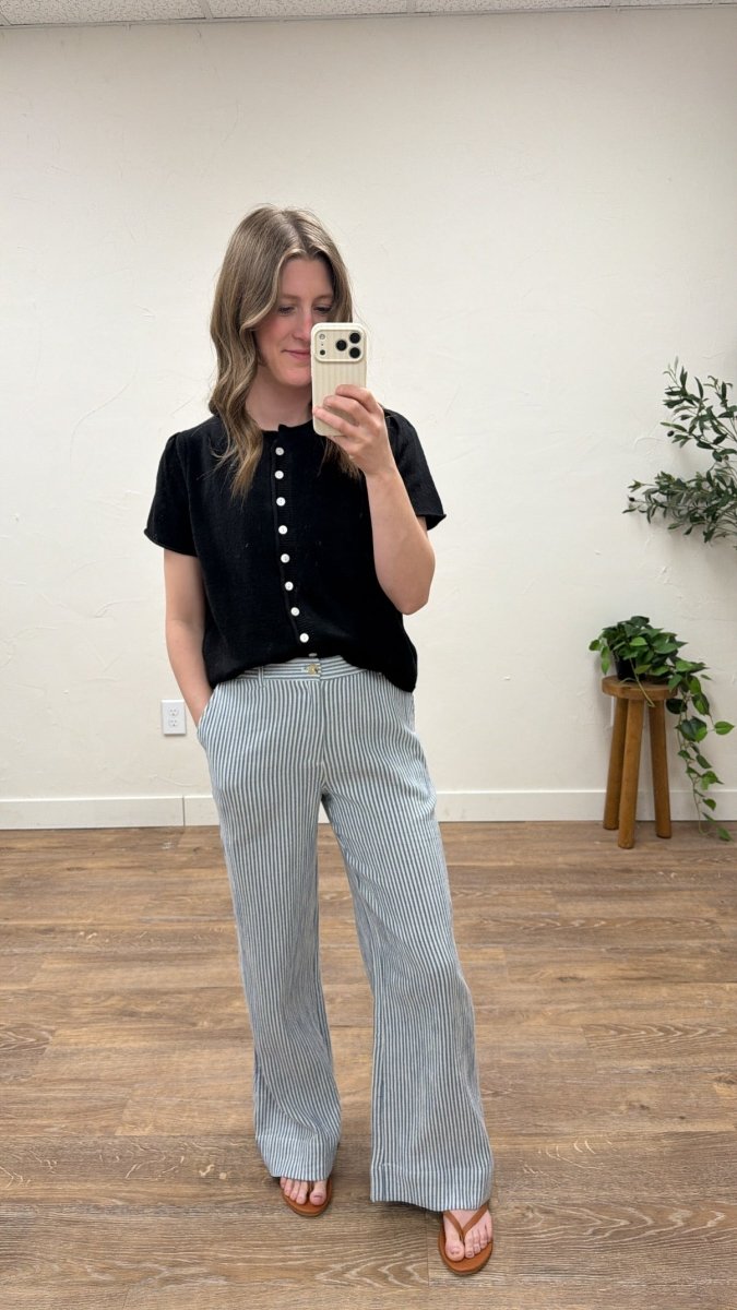 Front view of model wearing short sleeve button cardigan with puff sleeve detail — Three:Twelve Boutique