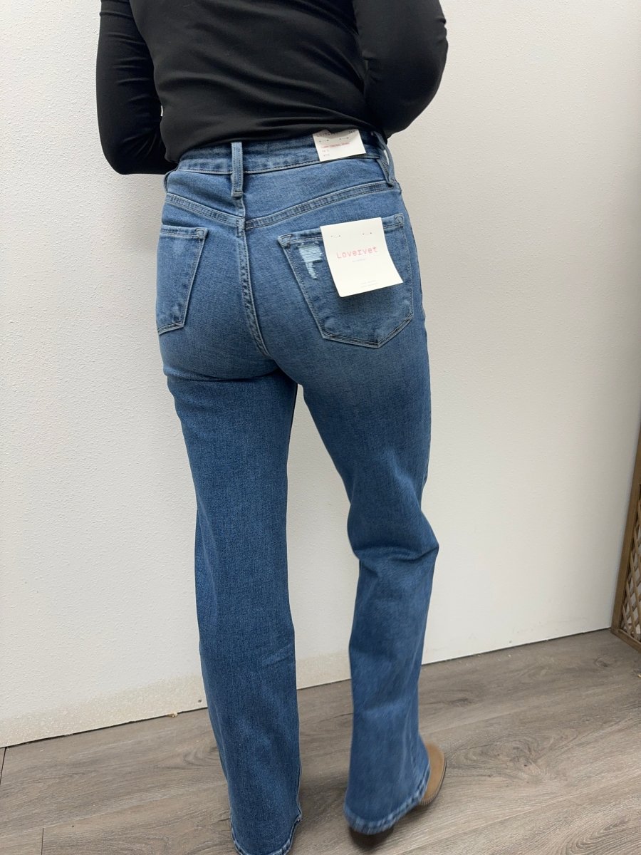 Back view of wide leg denim jeans on model showing relaxed silhouette — Three:Twelve Boutique