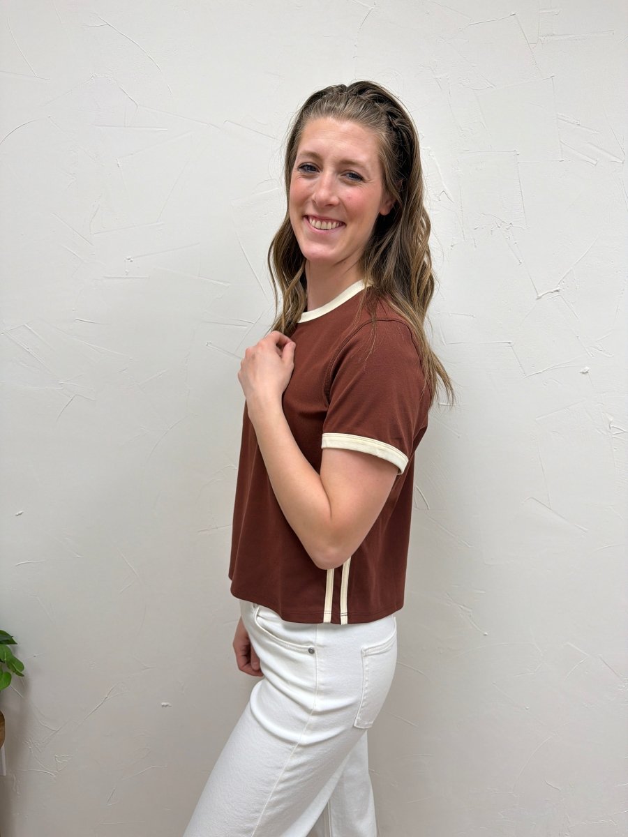 Side angle view of The Cait Top showing relaxed shape and sleeve detail — Three:Twelve Boutique