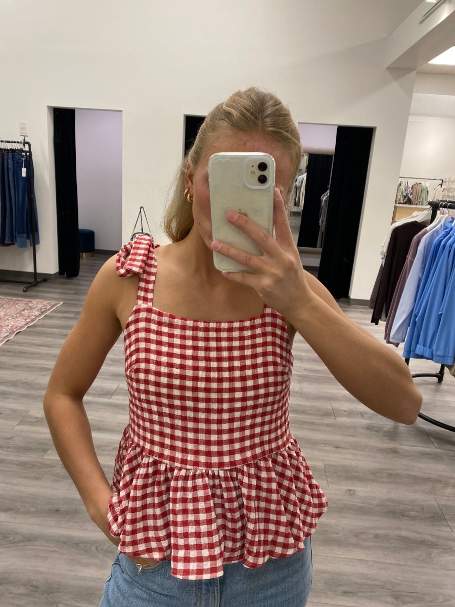 Close up of fabric texture and tie strap detail on red tank top — Three:Twelve Boutique