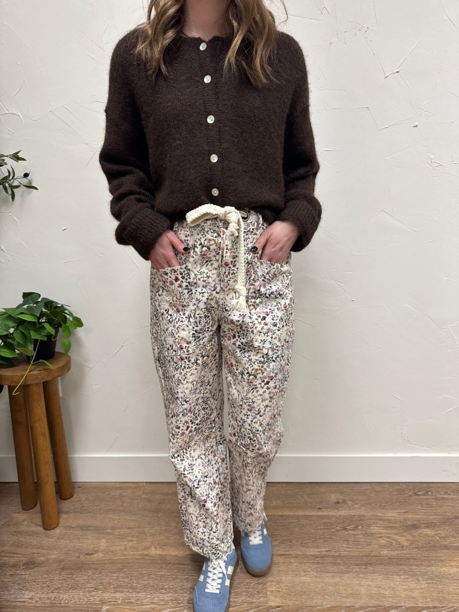 Lifestyle shot of model wearing floral pull on pants styled casually — Three:Twelve Boutique