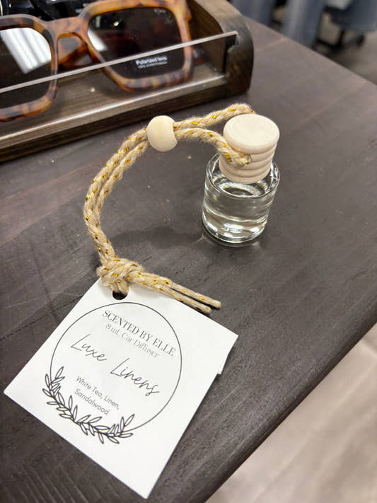 Front view of Luxe Linen Car Diffuser bottle showing label design — Three:Twelve Boutique