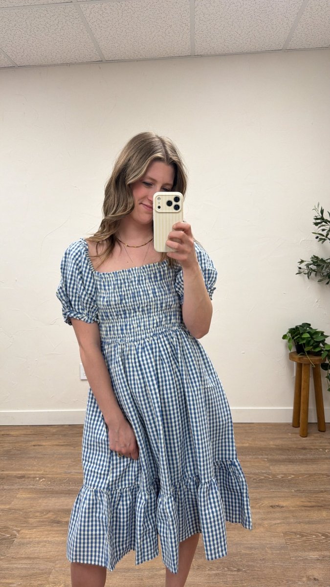 Front view of model wearing Alice gingham dress with puff sleeves and smocked chest — Three:Twelve Boutique