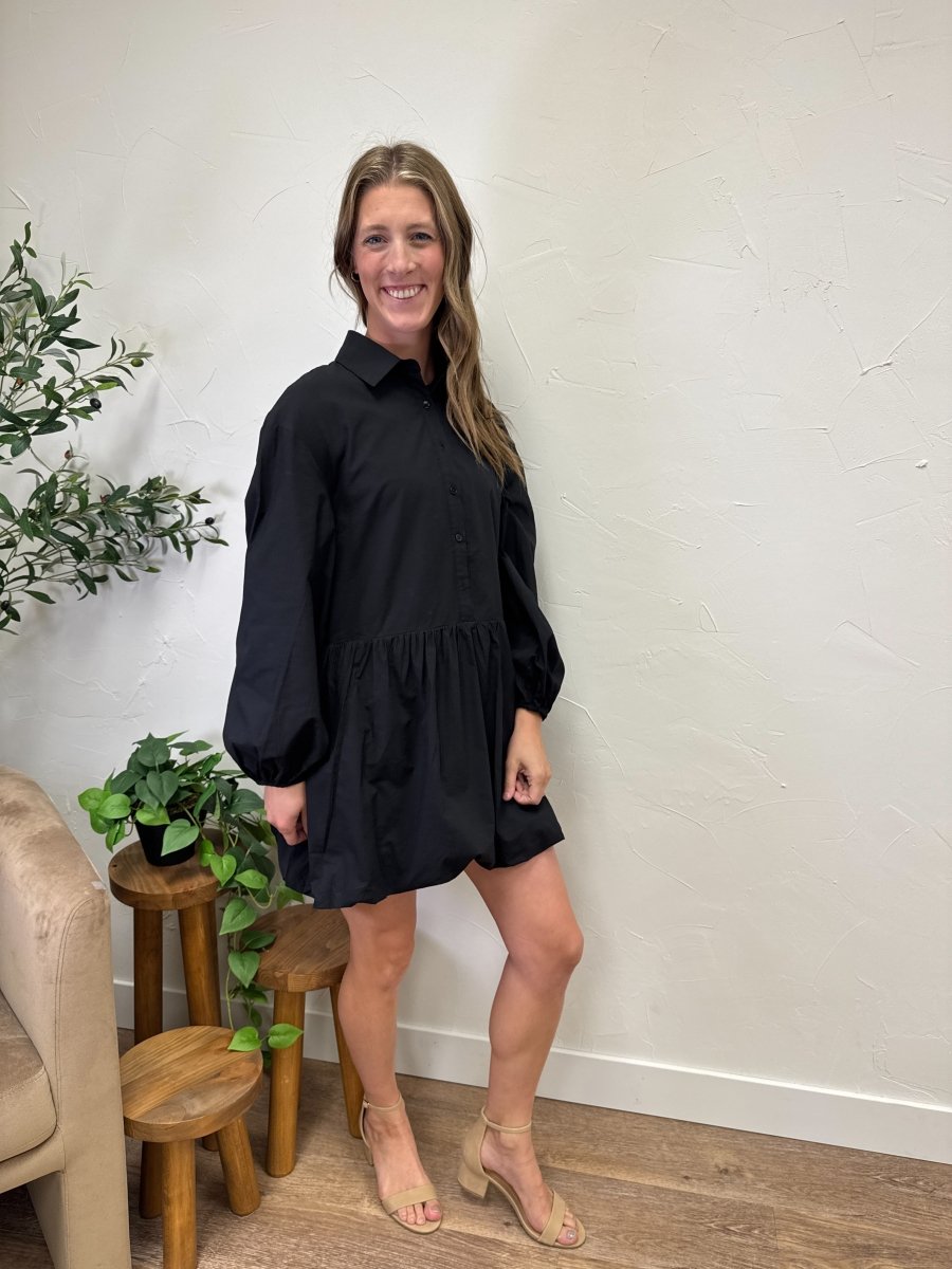 Lifestyle shot of model wearing balloon bottom mini dress with casual styling — Three:Twelve Boutique
