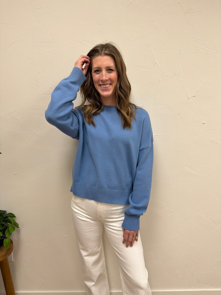 Lifestyle shot of model wearing Basic Relaxed Crop Sweater styled with high-waisted jeans — Three:Twelve Boutique
