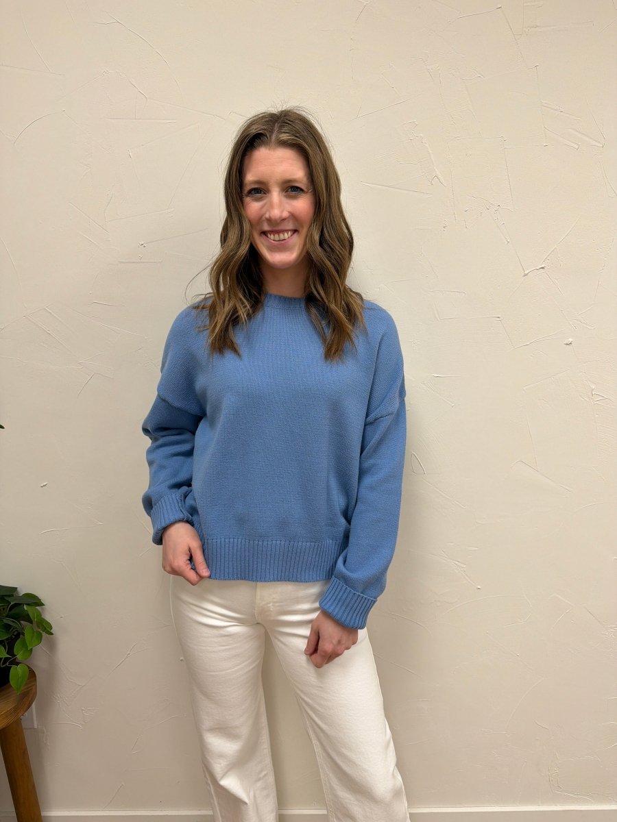 Lifestyle shot of model wearing Basic Relaxed Crop Sweater styled with high-waisted jeans — Three:Twelve Boutique