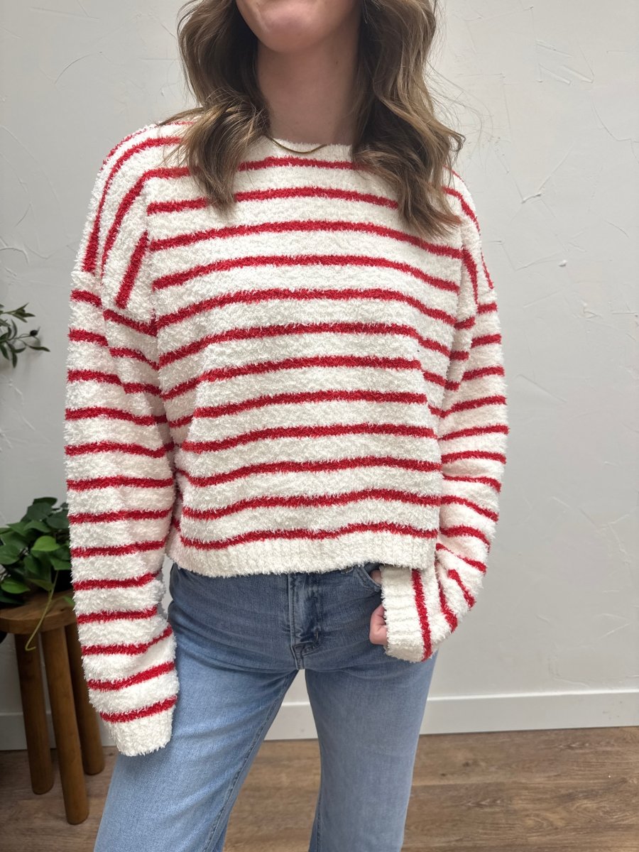 Close up of knit fabric texture and stripe detailing on sweater — Three:Twelve Boutique