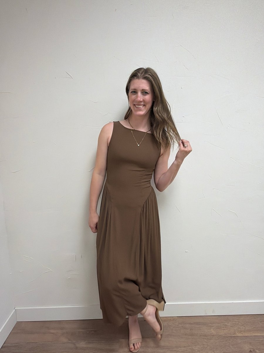 Lifestyle view of model wearing Boat Neck Sleeveless Midi Dress in elegant setting — Three Boutique
