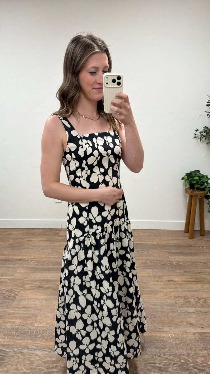 Side view of model wearing floral maxi dress showing drape and movement — Three:Twelve Boutique