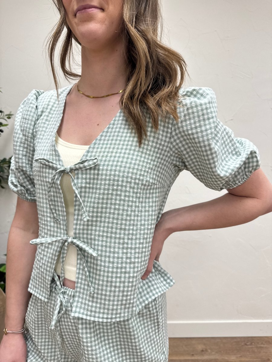 Close up of gingham fabric and bow front tie detail — Three:Twelve Boutique