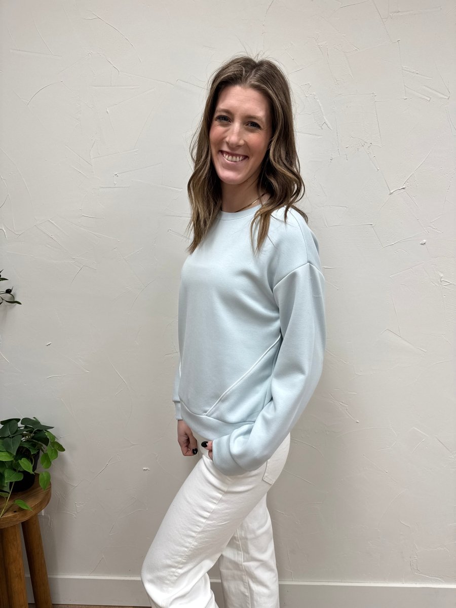 Side view of Britney Top showing drape and fit on model — Three:Twelve Boutique