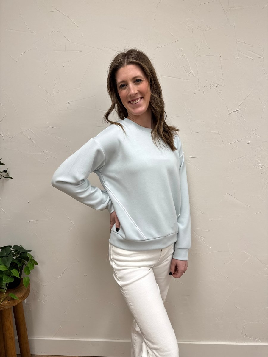 Side view of Britney Top showing drape and fit on model — Three:Twelve Boutique