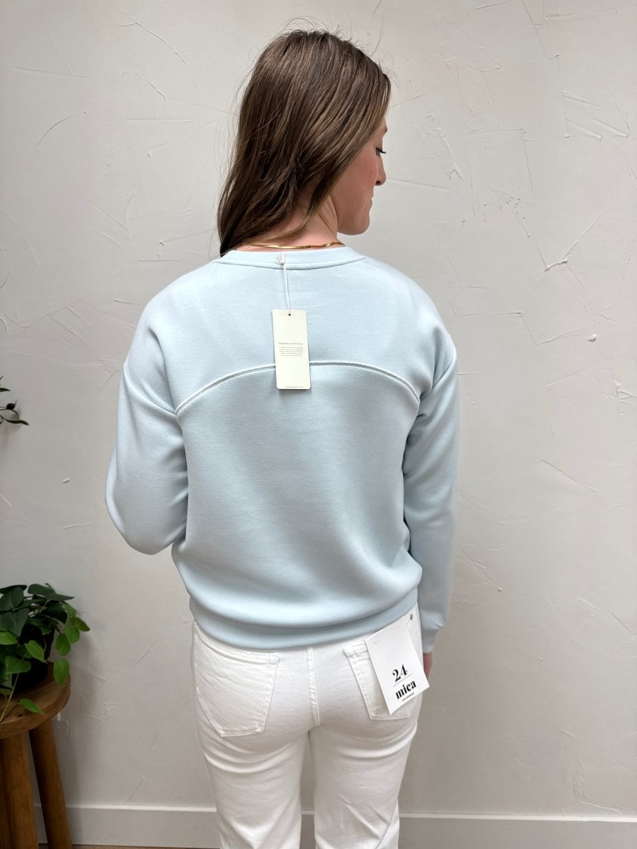 Back view of model wearing Britney Top with clean and simple design — Three:Twelve Boutique