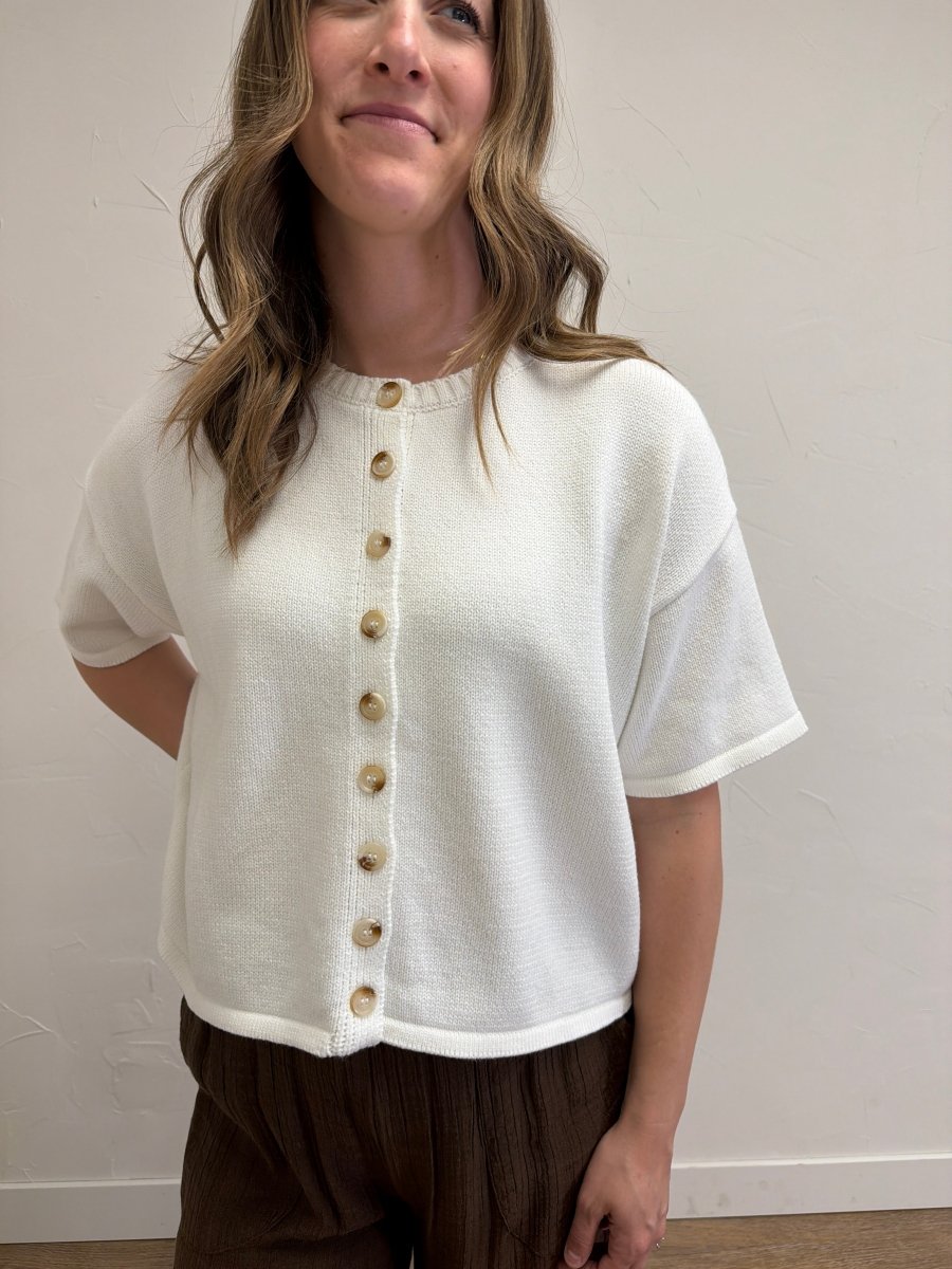 Close-up front view of model wearing Button Up Sweater Knit Top showcasing sweater knit texture and button details