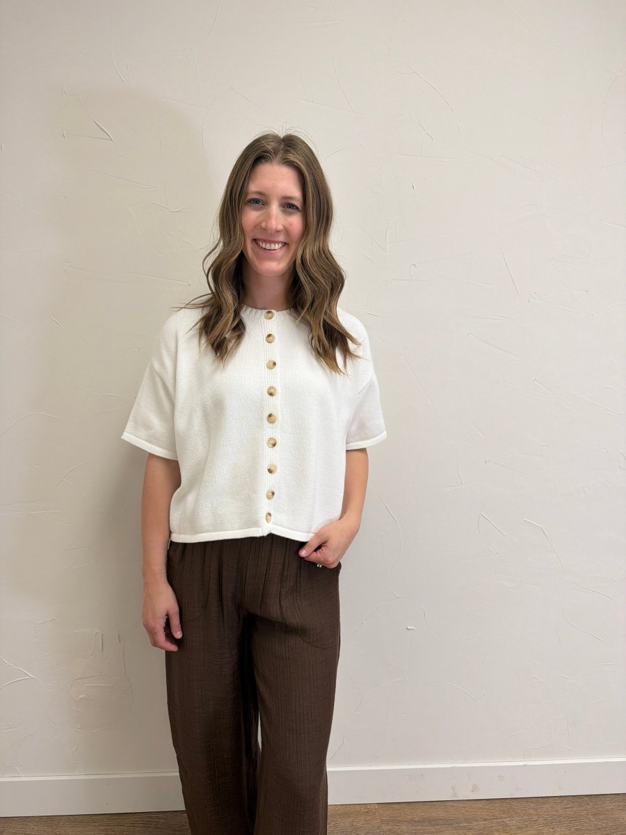 Front view of model wearing Button Up Sweater Knit Top for Women with functional button-front design