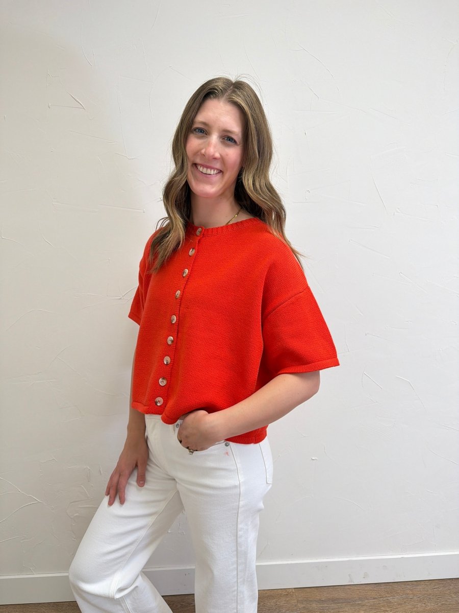 Side view of model wearing Button Up Sweater Knit Top with relaxed cropped silhouette