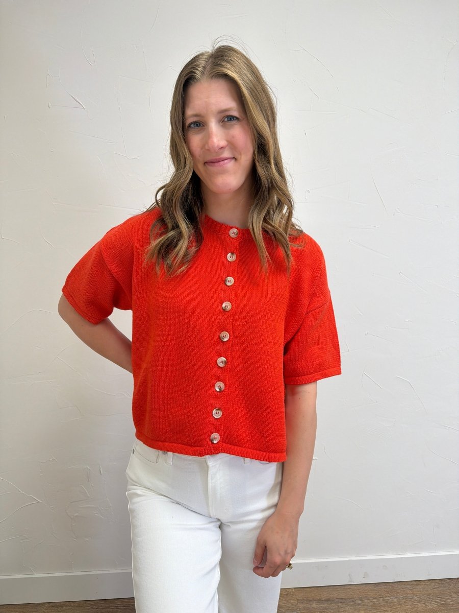 Front view of model wearing Button Up Sweater Knit Top for Women with functional button-front design