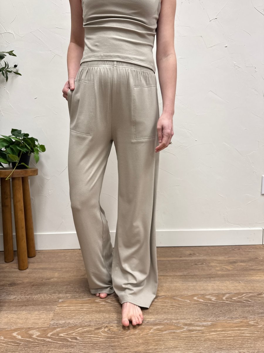 Lifestyle shot of model wearing casual wide leg pants styled with matching tank top — Three:Twelve Boutique