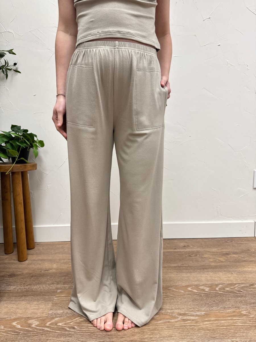 Lifestyle shot of model wearing casual wide leg pants styled with matching tank top — Three:Twelve Boutique