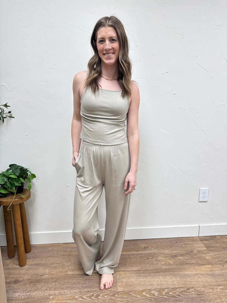 Lifestyle shot of model wearing casual wide leg pants styled with matching tank top — Three:Twelve Boutique