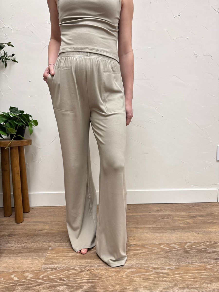 Lifestyle shot of model wearing casual wide leg pants styled with matching tank top — Three:Twelve Boutique