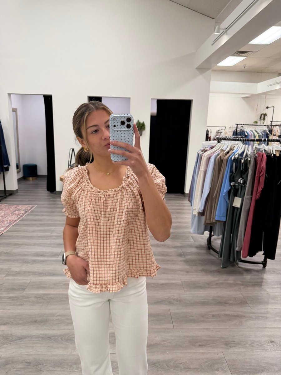 Front view of model wearing checkered puff sleeve top with button front detail — Three:Twelve Boutique