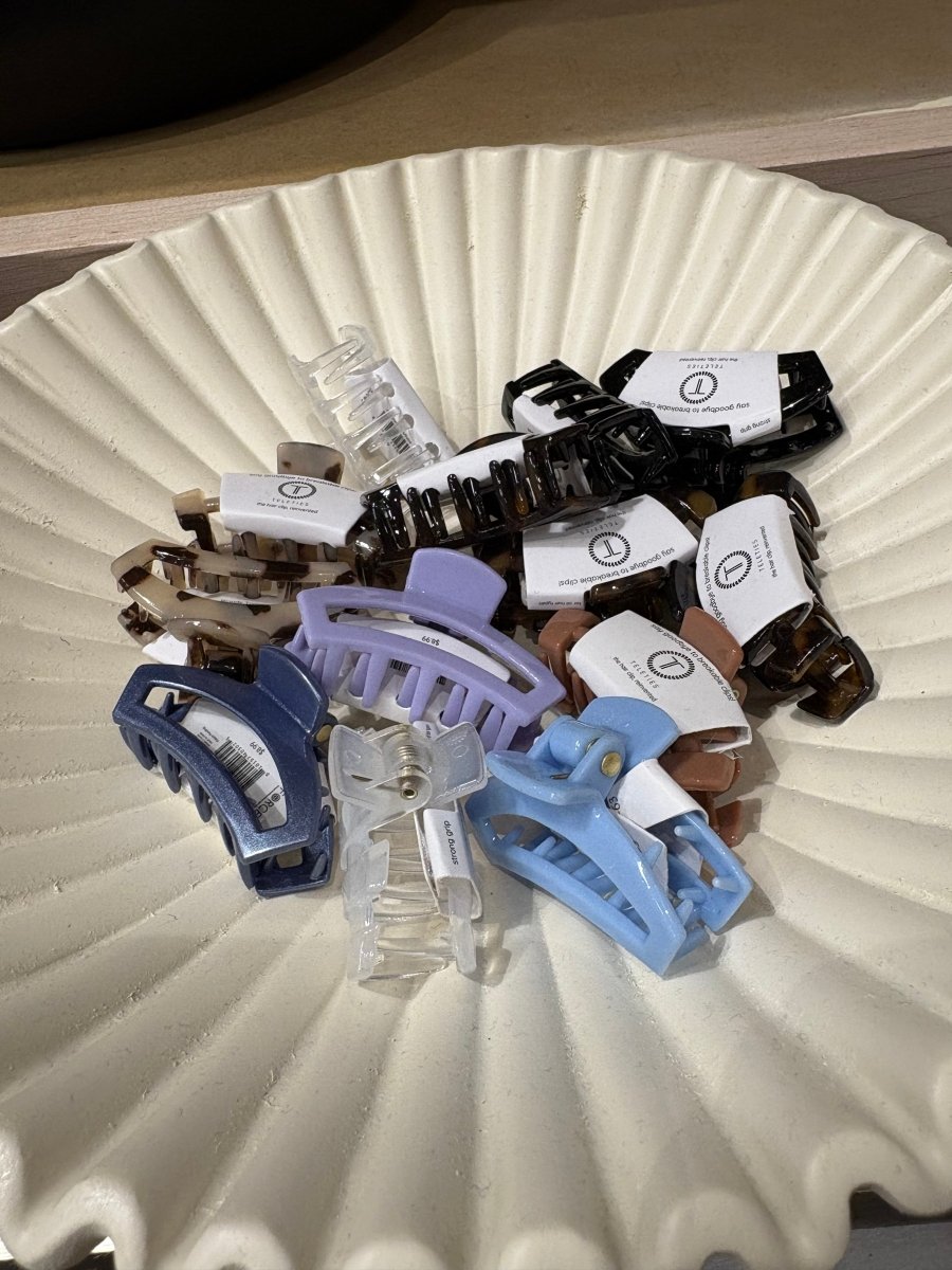 Top view of assorted tiny hair claws arranged together — Three:Twelve Boutique