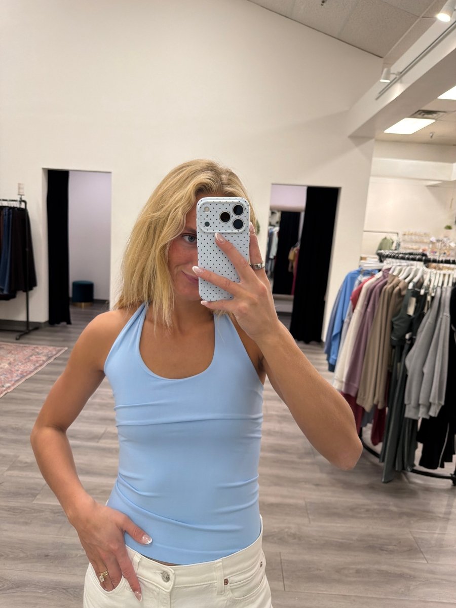 Front view of model wearing Clean Line Halter Top with fitted halter neckline — Three:Twelve Boutique