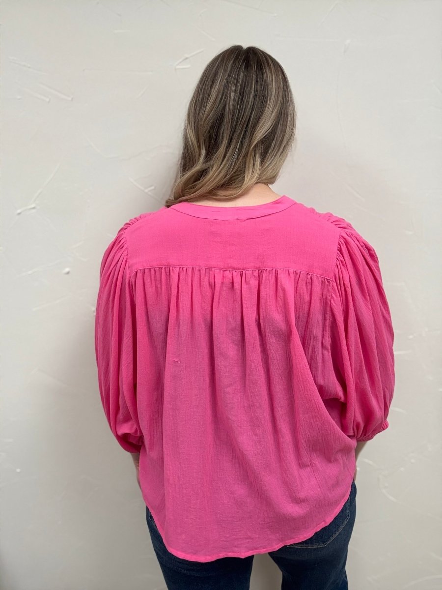 Back view of model wearing cotton peasant blouse showing loose silhouette — Three:Twelve Boutique