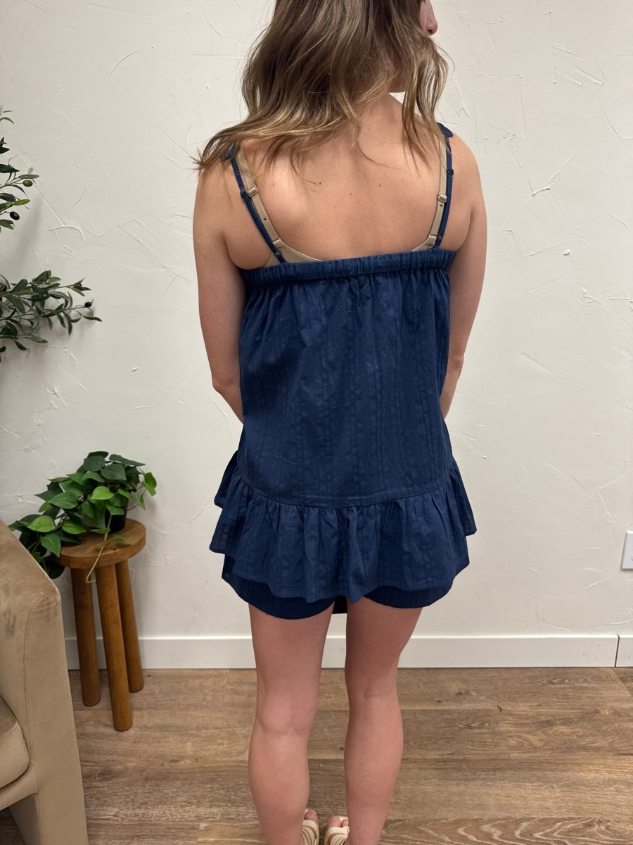 Back view of model showing cotton cami top and relaxed shorts fit — Three:Twelve Boutique