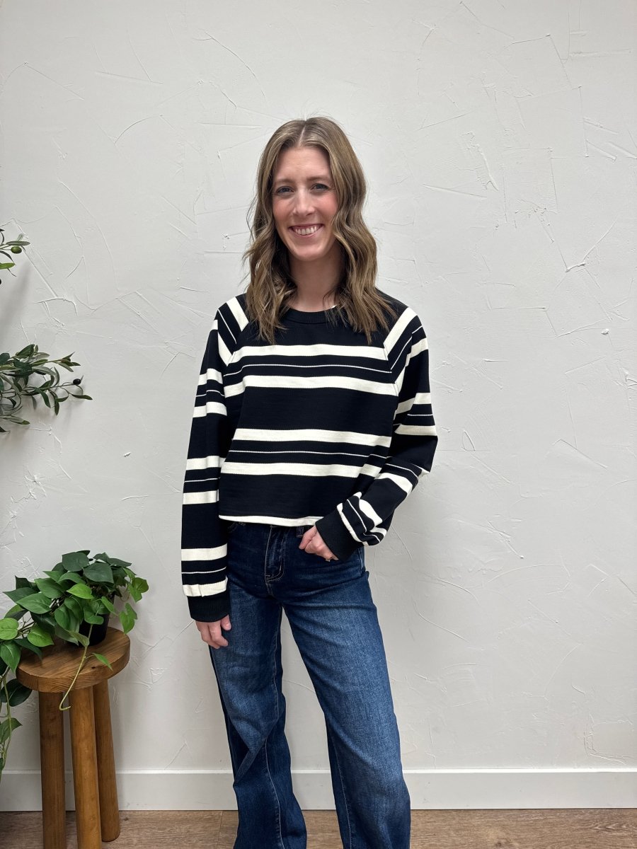Lifestyle shot of model wearing Dakota striped pullover styled casually — Three:Twelve Boutique