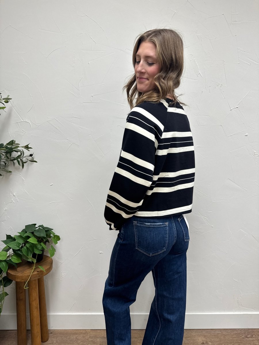 Side view of model wearing Dakota striped pullover showing relaxed silhouette — Three:Twelve Boutique