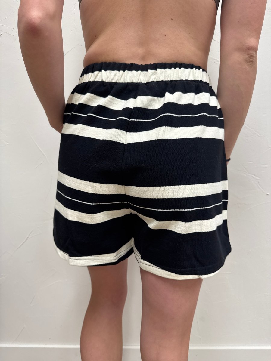 Back view of Dakota striped shorts on model showing fit — Three:Twelve Boutique