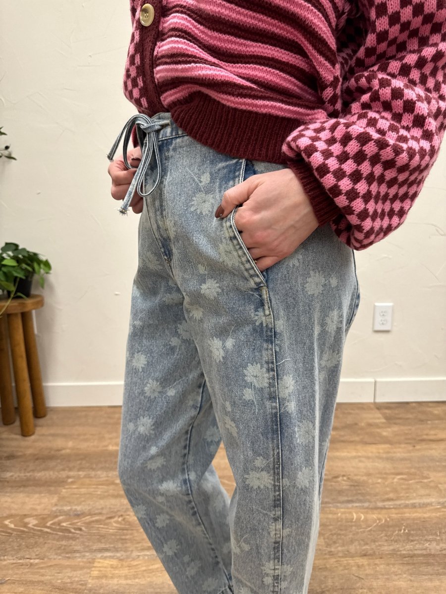 Side view of relaxed fit denim jeans showing straight leg silhouette — Three:Twelve Boutique