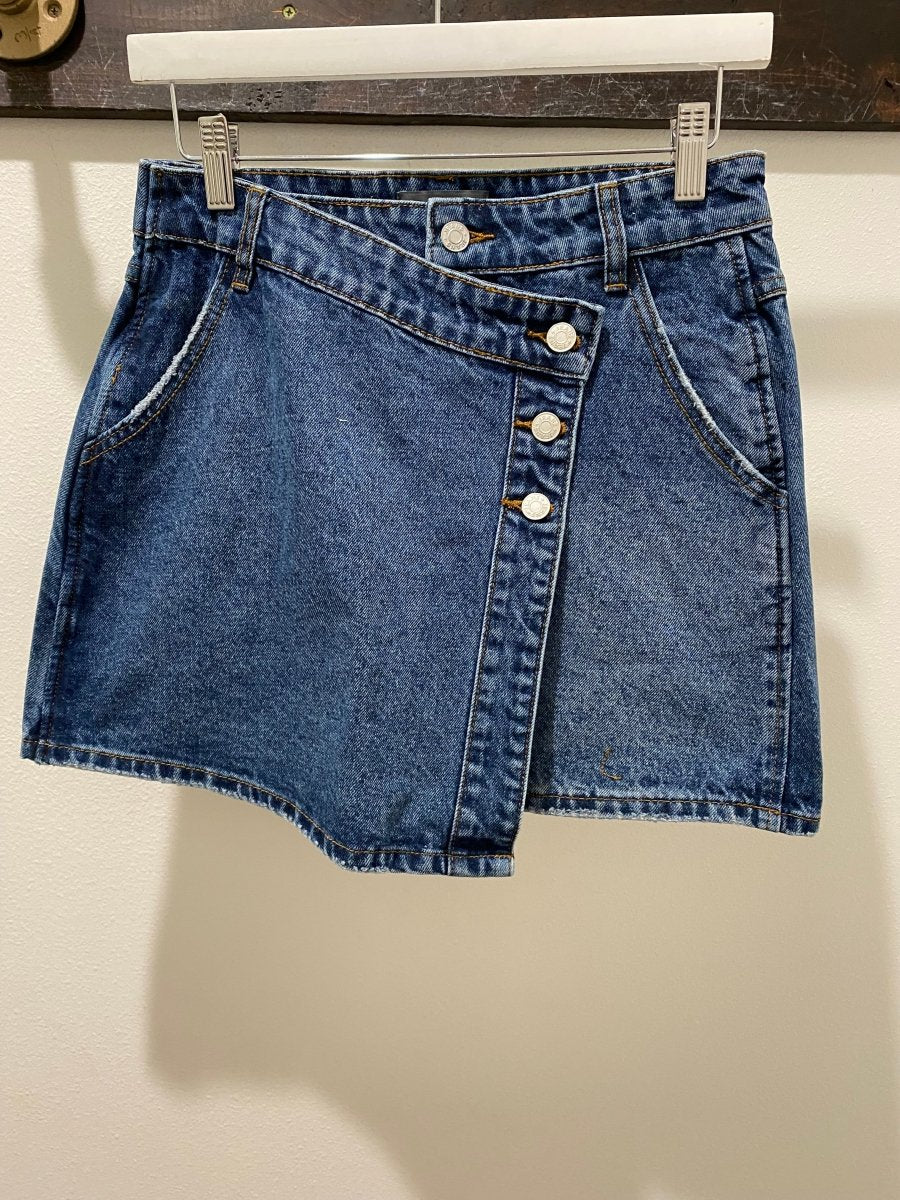 Front view of denim mini skirt showing structured 100% cotton design — Three:Twelve Boutique