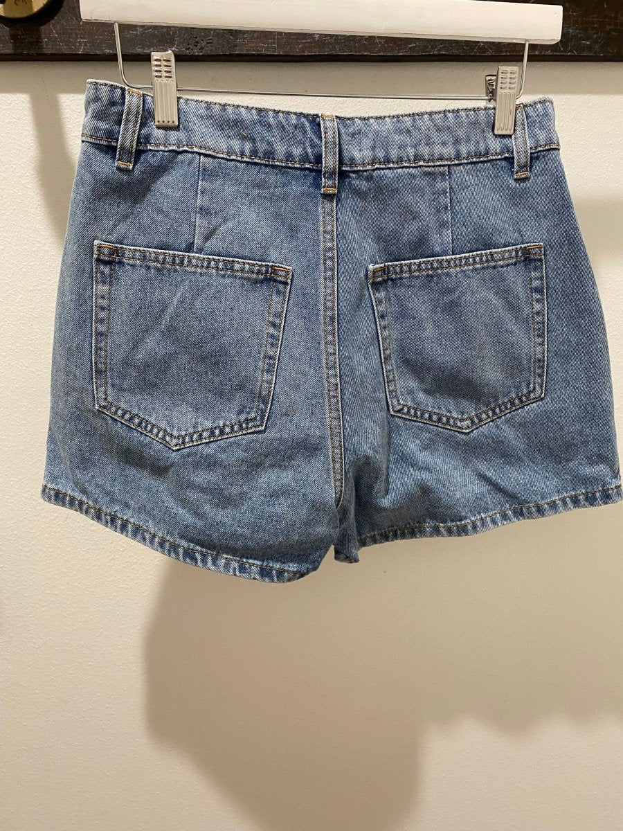 Close up of denim fabric texture and stitching detail on skort — Three:Twelve Boutique
