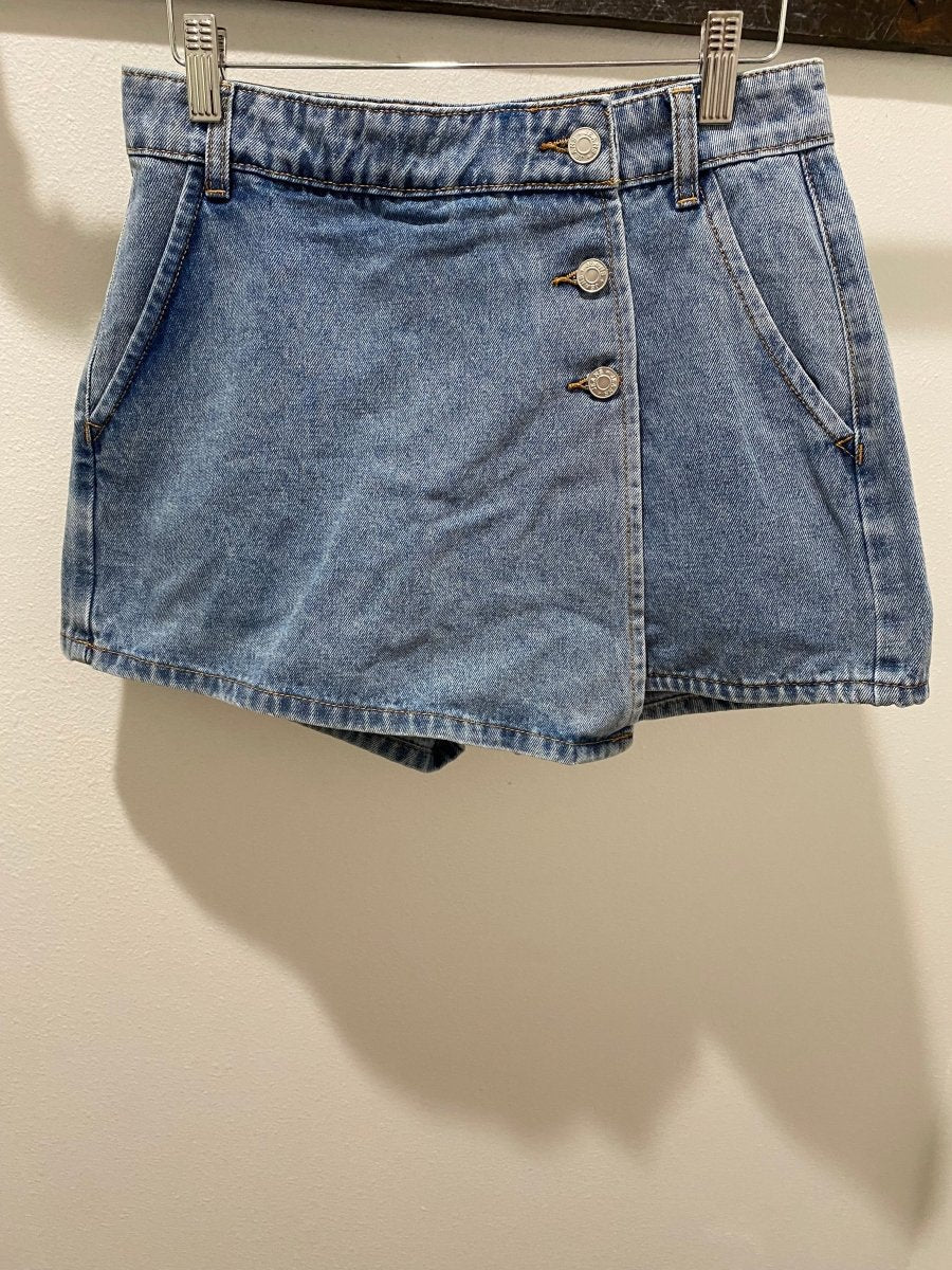 Close up of denim fabric texture and stitching detail on skort — Three:Twelve Boutique