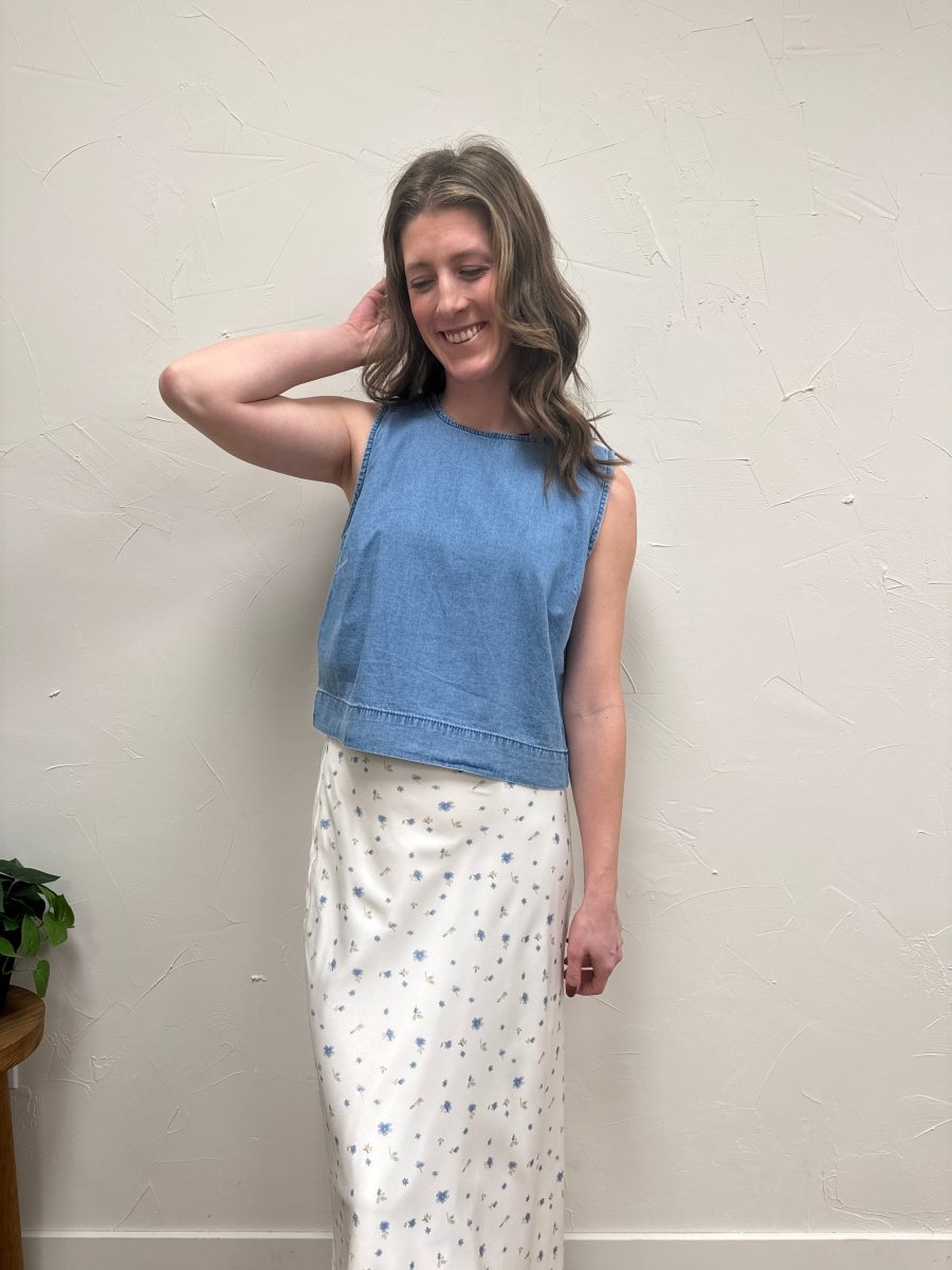 Lifestyle shot of model wearing denim tank top styled with casual bottoms — Three:Twelve Boutique