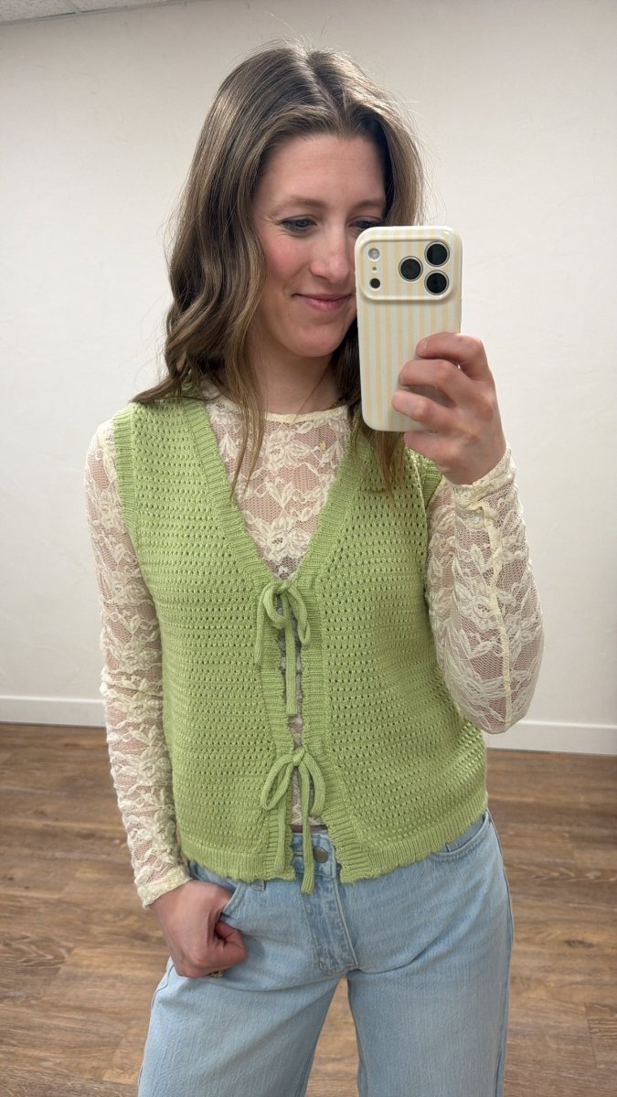 Front view of model wearing sweater vest with double bow tie front detail — Three:Twelve Boutique