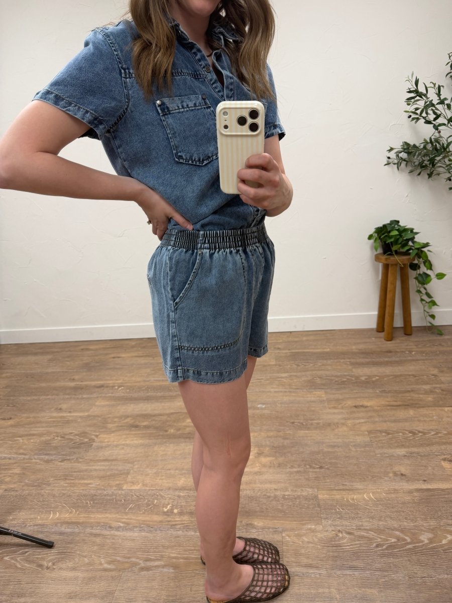 Side view of elastic waist chambray mini shorts showing short length silhouette — Three:Twelve Boutique